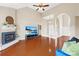 Open living room with hardwood floors, fireplace, and lots of natural light at 4809 Mossy Cup Ln, Monroe, NC 28110