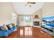Bright living room features hardwood floors, a fireplace, and a vaulted ceiling at 4809 Mossy Cup Ln, Monroe, NC 28110