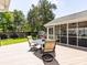Inviting back deck with outdoor seating and adjacent screened-in porch, perfect for entertaining or relaxing outdoors at 4925 Cedar Forest Dr, Charlotte, NC 28226