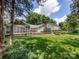 Expansive backyard with mature trees, screened-in porch, and deck offering ample space for outdoor activities and leisure at 4925 Cedar Forest Dr, Charlotte, NC 28226