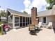 Backyard deck featuring comfortable outdoor seating, a table, and a screened-in porch at 4925 Cedar Forest Dr, Charlotte, NC 28226