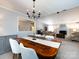 Bright dining room features hardwood table, stylish chandelier, and views of the spacious living area at 4925 Cedar Forest Dr, Charlotte, NC 28226