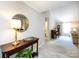 Inviting entryway with tiled floors and decorative console table, offering a glimpse into the spacious living areas at 4925 Cedar Forest Dr, Charlotte, NC 28226