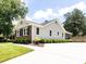 Charming home exterior featuring brick accents, well-maintained landscaping, and a spacious driveway, offering curb appeal at 4925 Cedar Forest Dr, Charlotte, NC 28226
