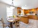 An open concept kitchen with a round table and seating for four at 4925 Cedar Forest Dr, Charlotte, NC 28226
