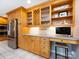 A kitchen featuring maple cabinetry, stainless steel appliances, and a countertop workspace at 4925 Cedar Forest Dr, Charlotte, NC 28226