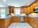 Bright kitchen with wooden cabinets, stainless steel appliances, and a spacious layout for easy cooking at 4925 Cedar Forest Dr, Charlotte, NC 28226