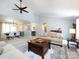 Bright open-concept living space connects to the dining area, featuring comfortable seating and neutral decor at 4925 Cedar Forest Dr, Charlotte, NC 28226