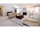 Cozy living room has a white fireplace, neutral furniture, and a decorative rug, creating a comfortable atmosphere at 4925 Cedar Forest Dr, Charlotte, NC 28226