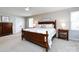 A serene bedroom featuring a bed, a ceiling fan, and lots of natural light at 4925 Cedar Forest Dr, Charlotte, NC 28226