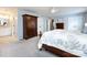 A bedroom with an en-suite bathroom and dark wood furniture at 4925 Cedar Forest Dr, Charlotte, NC 28226