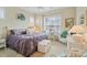 Comfortable bedroom featuring a cozy desk with a large window at 499 Granite Lake Ct, Denver, NC 28037