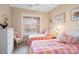 Bright bedroom with two twin beds and a large window at 499 Granite Lake Ct, Denver, NC 28037