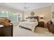 Beautiful bedroom with a large window, ceiling fan, and stylish furnishings at 499 Granite Lake Ct, Denver, NC 28037