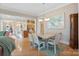 Dining room with table, chairs, and view into the kitchen at 499 Granite Lake Ct, Denver, NC 28037