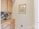 Hallway featuring ample cabinet space with a picture frame, and a nightlight at 499 Granite Lake Ct, Denver, NC 28037