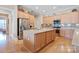 Spacious kitchen featuring a large island with granite countertops and stainless steel appliances at 499 Granite Lake Ct, Denver, NC 28037