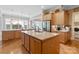 Open kitchen featuring large island, stainless steel appliances, and ample cabinet space at 499 Granite Lake Ct, Denver, NC 28037