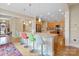 Bright, open kitchen features granite countertops, island with seating, and stainless steel appliances at 499 Granite Lake Ct, Denver, NC 28037