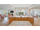 Open concept kitchen with granite island, hardwood floors, and stainless steel appliances at 499 Granite Lake Ct, Denver, NC 28037