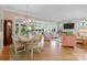 Open-concept living area and dining area with hardwood floors and lots of natural light at 499 Granite Lake Ct, Denver, NC 28037