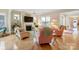 Bright living room featuring a fireplace, hardwood floors, and comfortable seating at 499 Granite Lake Ct, Denver, NC 28037