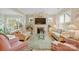 Bright living room featuring a fireplace, hardwood floors, and comfortable seating at 499 Granite Lake Ct, Denver, NC 28037