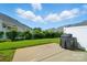 Serene backyard with a well-maintained lawn, mature landscaping, and ample space for outdoor enjoyment at 513 Pate Dr, Fort Mill, SC 29715