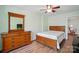 This bedroom features hardwood floors, light green paint, and wooden furniture at 513 Pate Dr, Fort Mill, SC 29715
