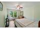 Cozy bedroom with hardwood floors, bright windows, television, and wooden dresser at 513 Pate Dr, Fort Mill, SC 29715