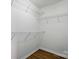 Walk-in closet with wire shelving and wood-look floor offers efficient storage space at 513 Pate Dr, Fort Mill, SC 29715