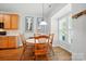 Bright dining area featuring wood floors, a round table, and natural light from window at 513 Pate Dr, Fort Mill, SC 29715