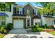 Charming brick townhome featuring a one-car garage and well-maintained landscaping at 513 Pate Dr, Fort Mill, SC 29715