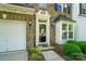 Close-up of the front door with decorative trim and sidelight window on a brick facade at 513 Pate Dr, Fort Mill, SC 29715