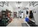 Spacious garage with overhead lighting, shelving for storage, and hooks for organization at 513 Pate Dr, Fort Mill, SC 29715