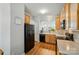Functional kitchen with black appliances, wooden cabinetry, and ample counter space at 513 Pate Dr, Fort Mill, SC 29715