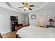 Bright bedroom features ceiling fan, hardwood floors, and access to en-suite bathroom at 513 Pate Dr, Fort Mill, SC 29715