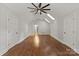 Spacious bedroom with hardwood floors, skylights, and two entry doors at 516 Amanda Dr, Weddington, NC 28104