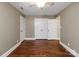 Bedroom with hardwood floors, ample closet space, and neutral paint at 516 Amanda Dr, Weddington, NC 28104