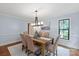Elegant dining room featuring stylish lighting, hardwood floors, and neutral decor at 516 Amanda Dr, Weddington, NC 28104