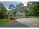 Home exterior with an attached garage, well-manicured landscaping, and a paved driveway providing curb appeal at 516 Amanda Dr, Weddington, NC 28104