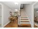 Inviting foyer with hardwood floors, a staircase, and views of the living areas at 516 Amanda Dr, Weddington, NC 28104