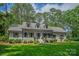 Charming single-story home with lush green lawn, dormer windows, and mature trees at 516 Amanda Dr, Weddington, NC 28104