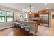 Modern kitchen with granite countertops, stainless steel appliances, and a breakfast bar at 516 Amanda Dr, Weddington, NC 28104