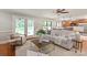 Bright living room with access to the backyard, views of the kitchen, and comfortable seating at 516 Amanda Dr, Weddington, NC 28104