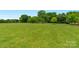 Expansive, well-manicured backyard offering plenty of space and a serene atmosphere at 5606 S Rocky River Rd, Monroe, NC 28112