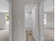 Hallway displaying two bedrooms and one full bath at 5606 S Rocky River Rd, Monroe, NC 28112