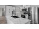 Modern kitchen features stainless steel appliances, and bright marble countertops at 5606 S Rocky River Rd, Monroe, NC 28112