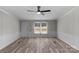 Sunlit living room featuring a neutral color palette, new floors, and a cozy atmosphere at 5606 S Rocky River Rd, Monroe, NC 28112