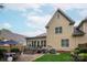 Spacious backyard featuring a patio, lush lawn, privacy fence, and mature trees at 5917 Bridger Ct, Charlotte, NC 28211